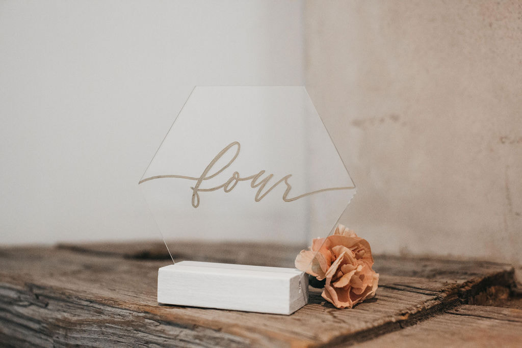 Clear lucite hexagon with written gold lettering - choice of clear (lucite), white (wood) or walnut (wood) stand